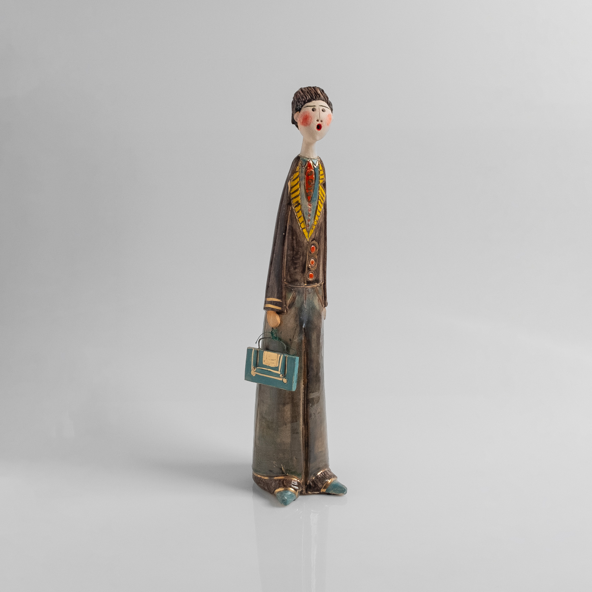 Figurine of a man in a suit carrying a briefcase | KORI Shop