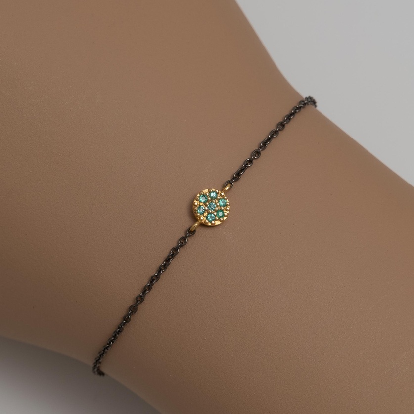 Bracelet in silver and gold with emeralds