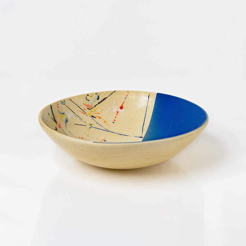 Round bowl in beige and light blue colors