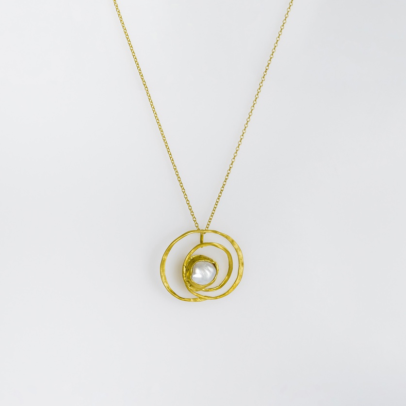 Gold spiral-shaped pendant with pearl