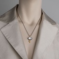 Modern silver pendant with gold and mother-of-pearl