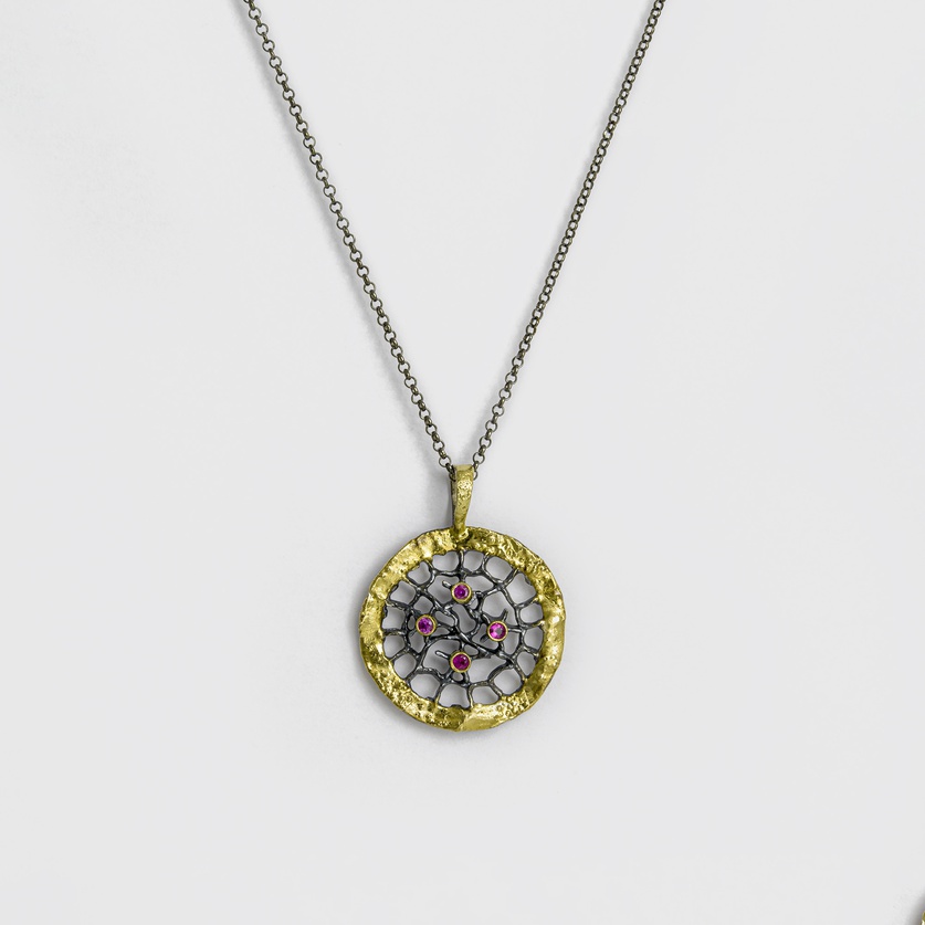 "Web" silver pendant with gold inlay and four rubies
