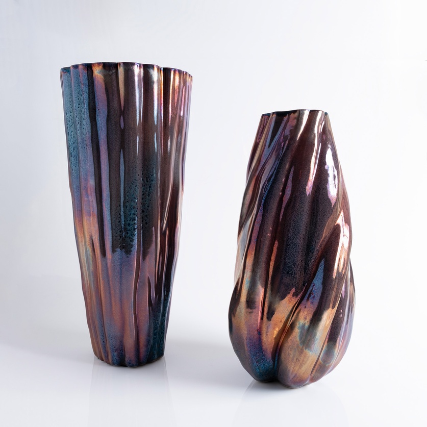 Captivating iridescent vase with striking curvature