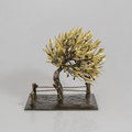 Bronze olive tree with fence