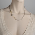 Beautiful necklace in silver and gold with white freshwater pearl