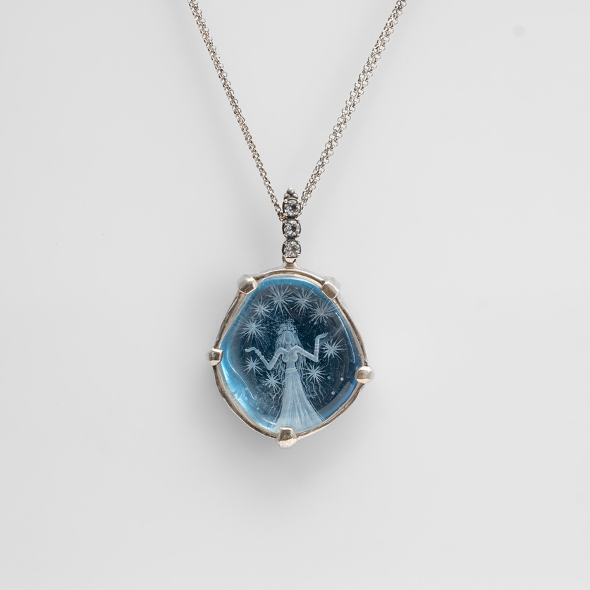 Necklace "The Daughter of the Stars" with engraved quartz and white topaz