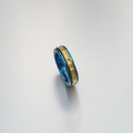 Forged double ring in titanium and gold