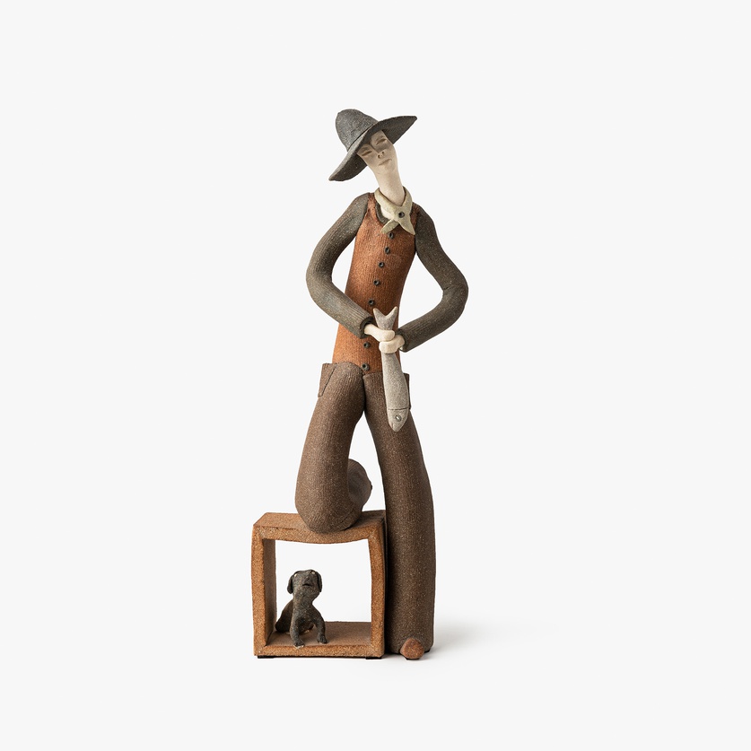 Figurine of a fisherman with his dog