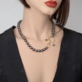 Modern black pearl necklace with gold