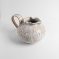 Ceramic pitcher with porcelain crackle finish