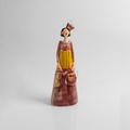Figurine of an elegantly dressed woman with elaborated style