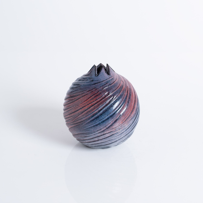 Carved ceramic pomegranate
