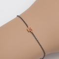 Bracelet in silver and gold with rubies