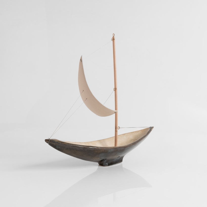 Ceramic sailboat of black colour