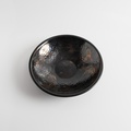 Black platter with iridescent surface