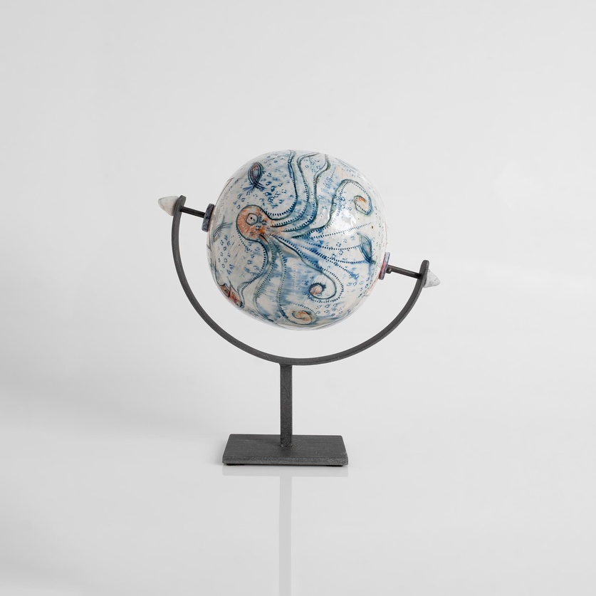 Ceramic globe on a metal base