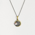 Spiral-shaped silver pendant with gold inlay and ruby