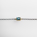 Bracelet in silver and gold with blue topaz
