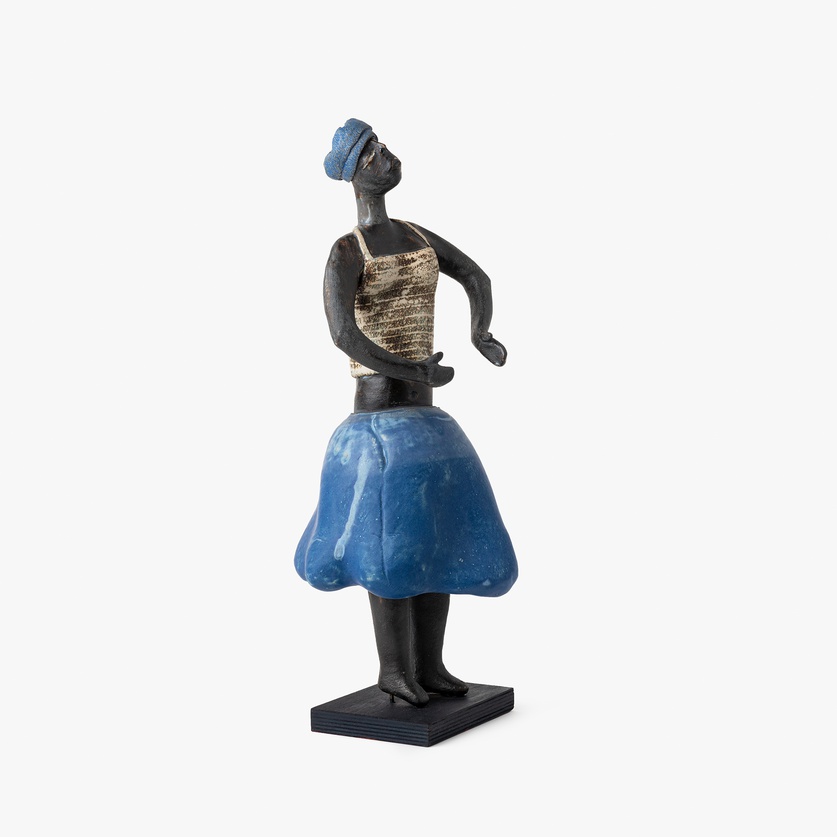 Figurine of a dancing woman in blue skirt