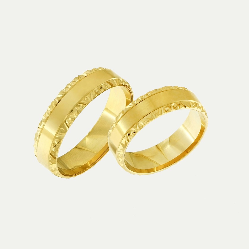 Gold wedding rings with a polished center and diamond-cut edges