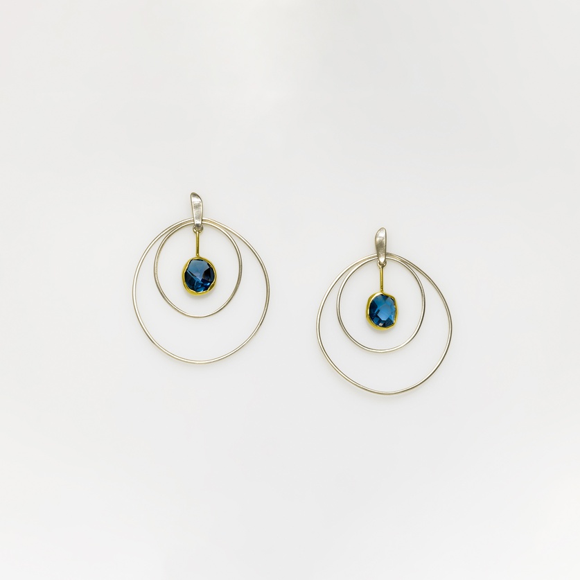 Stunning double hoop earrings with blue topaz