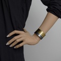 Impressive large bracelet in silver with stripes of gold