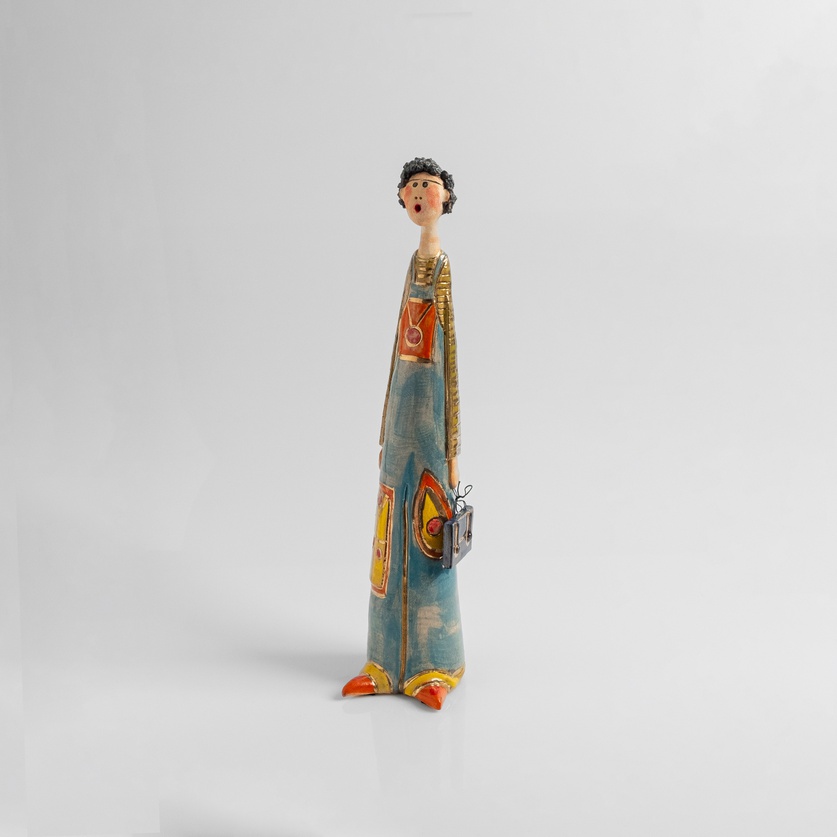 Figurine of a man in blue overalls