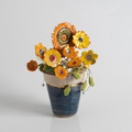 Ceramic flowers on a small pot