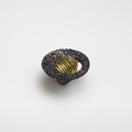 Imposing silver ring of rough surface with gold and rubies