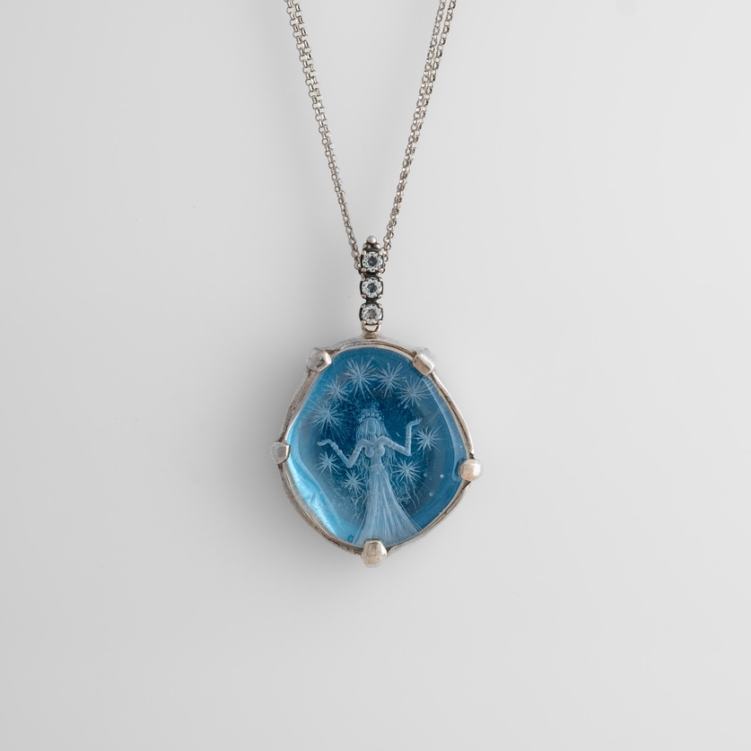 Necklace "The Daughter of the Stars" with engraved quartz and white topaz