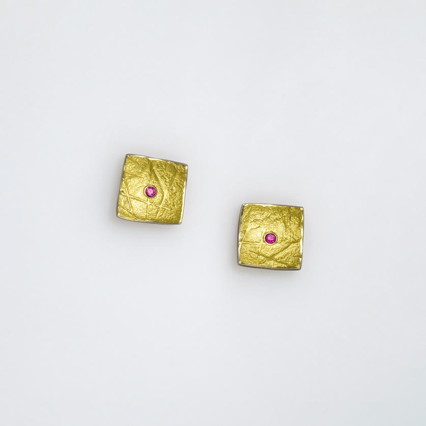 Square stud earrings in silver and gold with rubies