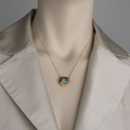 Circular pendant in silver and gold with aquamarine and diamonds