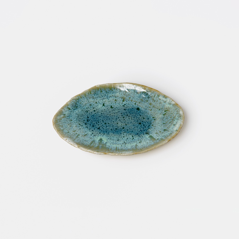 Turquoise ceramic platter of irregular shape