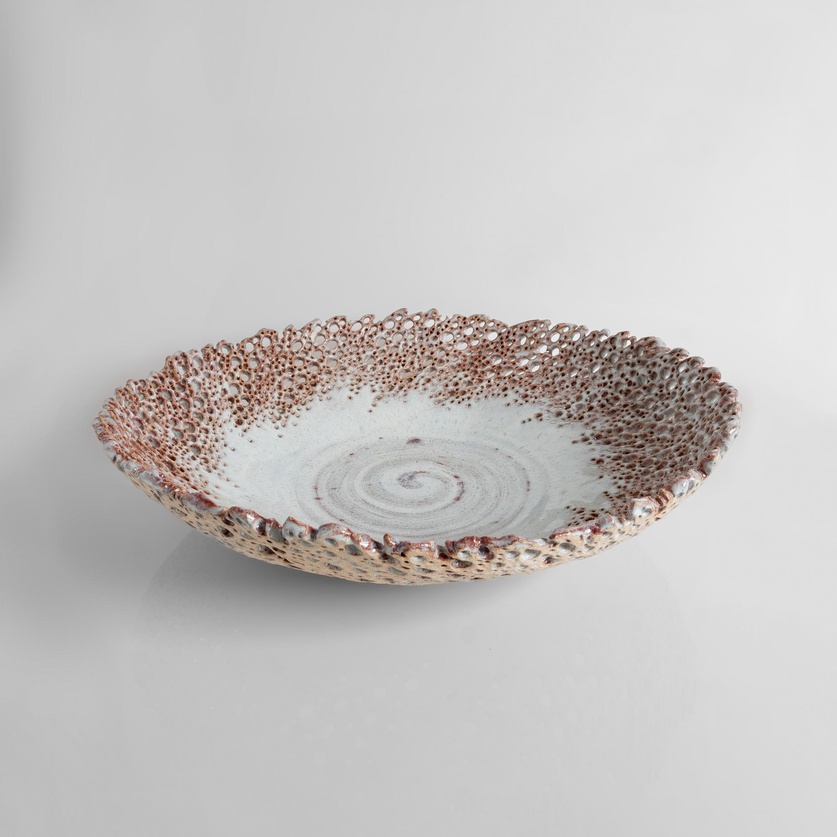 A perforated ceramic platter