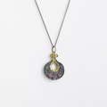 Graceful silver pendant with K18 gold inlay and rubies