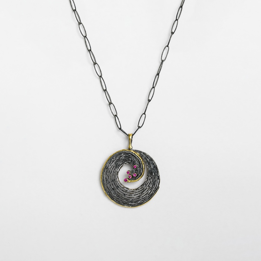 "Wave" pendant in silver, gold inlay and rubies