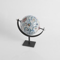 Ceramic globe on a metal base