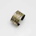 Silver cuff bracelet with gold stripes