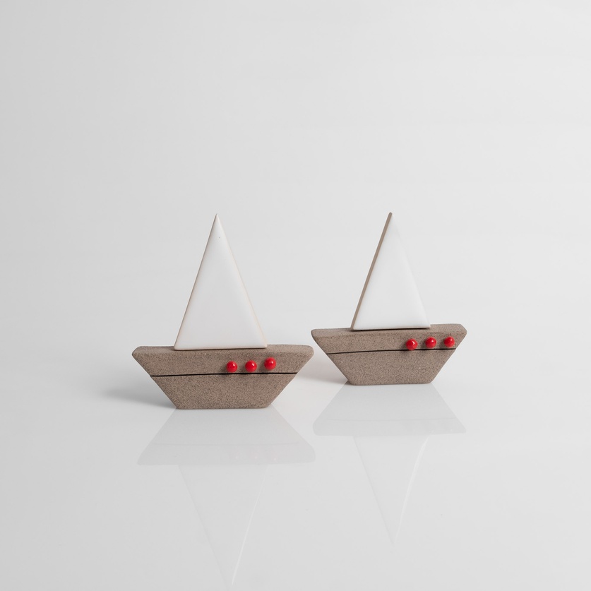 Ceramic sailboat with white sail