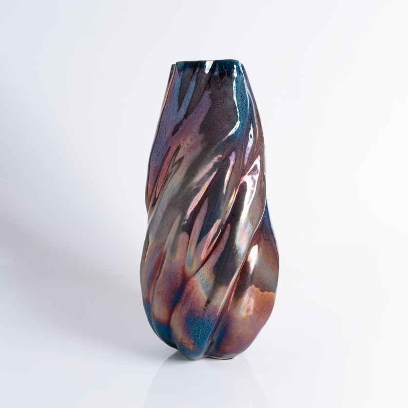 Captivating iridescent vase with striking curvature