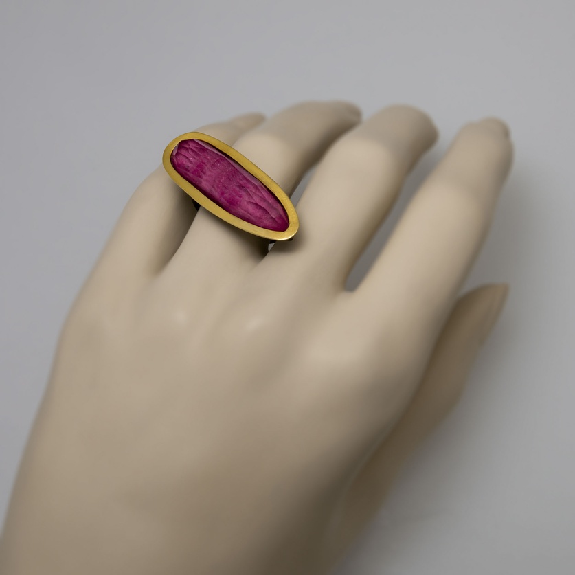 Silver ring with gold-encircled ruby doublet stone