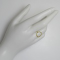 Minimalist lustrous gold ring with diamond