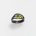 Elaborately designed ring with peridot and diamond