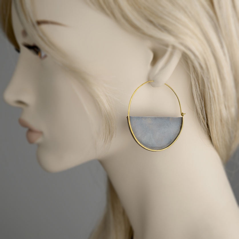 "Half-moon" hoops in gold and black silver