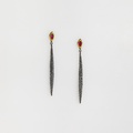 Stylish earrings in silver and gold with a red distinct ruby