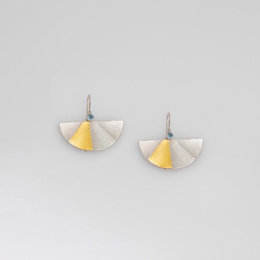 Beautiful earrings in silver and gold with blue topaz