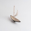 Ceramic sailboat of black colour